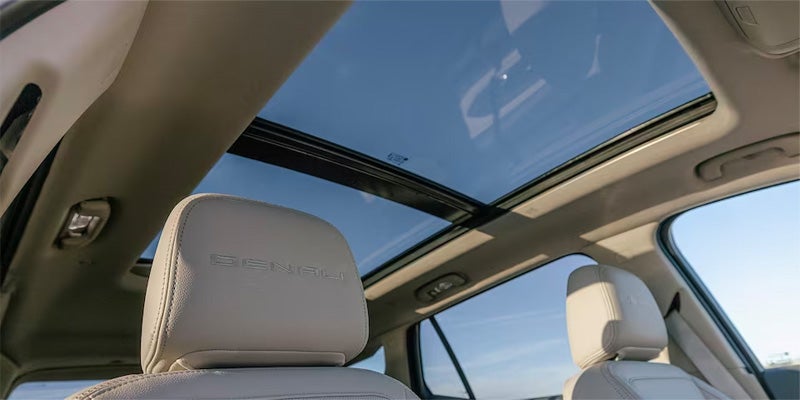 View looking up through a large panoramic glass sunroof.